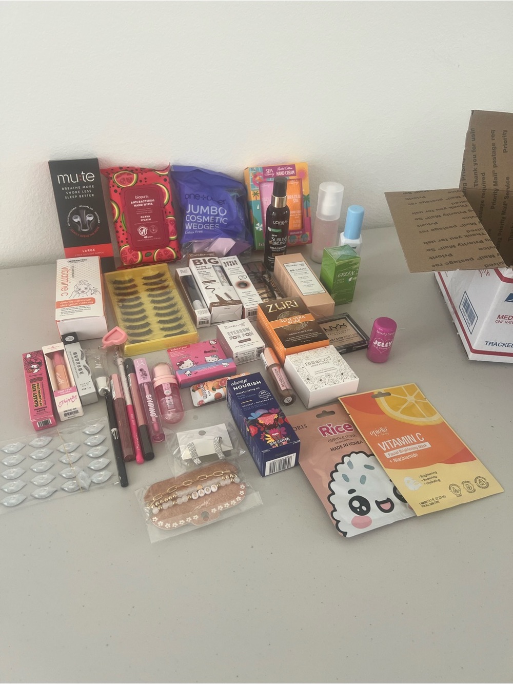 Box #2. Assorted Beauty & Skincare Lot - Pink, Purple, Orange Accents